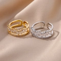 Macro view of gold and silver double-layered copper rings with emerald-cut cubic zirconia - Double Layer Intertwined Knot Style (4361)