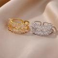 Close-up of gold and silver copper rings with double-row baguette cubic zirconia - Double Row Baguette Zirconia Style (4391) / Gold