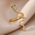 Detailed close-up of gold-plated snake ring with white zircon pave and green gem eyes - Style 10-Pave White Stones Green Eyes Snake