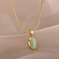 Detail of a gold satellite chain necklace featuring an oval green cat-eye stone pendant - Oval Pale Green Stone Style (G10104669G-3)