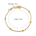 Detail of 18K gold plated bead anklet featuring a snake chain and five polished golden beads - Snake Chain with Beads (367)
