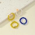Minimalist beaded ring set with heart, star, evil eye, and letter N charms for women - Multi-color Set