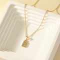 Elegant gold letter B pendant necklace with pavé crystal settings on white display - Letter B Style (X012-Letter B)
