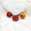 Macro shot of colorful 18K gold-plated enamel fruit pendants on lace fabric - Pomegranate 13*13.5mm