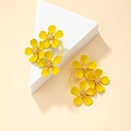 Vibrant yellow daisy earrings featuring three floral blooms on gold-tone circular bases - Yellow