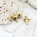 Golden Aries ram head charms with sparkling zirconia stones on white lace background - Deer Head Shape