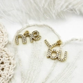 Close-up of gold-plated me and you letter pendants with micro-pave zircon crystals - YOU Letter Style