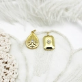 Detailed view of 18K gold plated celestial star and moon charms on white feathers - Waterdrop Hexagram