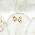 Detailed view of 18K gold heart pendant with zircon on feather and lace background - Super Mini Heart / 6.5*7.5mm