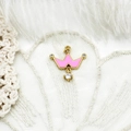 Detailed view of crown pendant with pink enamel and sparkling clear crystal accents - Pink Crown