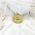 Detail of 18K gold plated celestial coin pendant with star and sun textured patterns - Sun Round