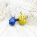Close-up of Fabergé style enamel egg pendants with blue marble and yellow bow designs - Yellow Egg (15.5*26mm)