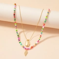Dubbellaagse kleurrijke polymeerklei ketting met een gouden schelphanger en slangenketting - Regenboogkralen Schelphanger Gelaagde Stijl (X241)