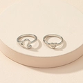 Silver Leo zodiac and heart engraved rings with 'ME' text on beige display stand - US 7 / Leo