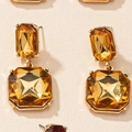 Elegant gold earrings with champagne rectangle and square crystals in a geometric design - Amber