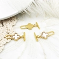 Close-up of four-leaf clover OT clasps with white shell and micro-pave crystals - White Shell Zircon Clover
