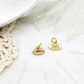 Detail of gold lip-shaped charms with micro-inlaid zircon for DIY jewelry making - Lip