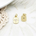 Macro view of gold pendant showing star engraving with zircon and dotted texture back - Rectangular Tag