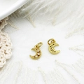Macro shot of gold moon pendants with zircon micro-inlay and hollow carving details - Hollow Moon and Star Necklace
