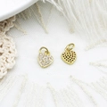 Macro detail of gold heart charms showing micro-pave zircon setting and hollow honeycomb back - Full Zirconia Heart