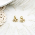 Detailed front and back view of gold evil eye pendants with sparkling pavé zircons - Zircon Eye