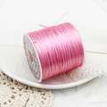 Close-up of pink elastic crystal string for DIY jewelry making on a white spool - Pink 60m/Roll