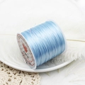 Macro detail of light blue elastic beaded cord spool on a white decorative background - Light Blue 60m/Roll