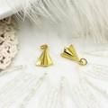 Close-up of gold paper plane charms with zircon inlay for DIY jewelry and necklaces - Smooth Paper Plane