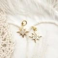 Macro detail of 18K gold star pendants with micro-pave crystals on white feather - Chubby Hexagram (14*12mm)