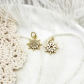 Close-up of 18K gold star pendants with micro-pave zircon on elegant lace and feather background - Small Sun Hexagram (15*12.8mm)