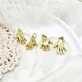 Detailed view of four golden Hamsa hand pendants with blue evil eye rhinestones - Blue Eye Palm