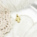 Macro shot of gold cross pendant with indented lines on soft white feather background - Cross Style (16.7*9mm)