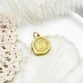 Macro shot of vintage matte gold Virgin Mary pendant with detailed religious relief - Hexagonal Portrait Style (15.9*12.7mm)
