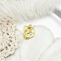 Close-up of a vintage gold-toned coin pendant featuring female portrait and zircon - Trapezoidal Portrait Style (17.3*12.5mm)