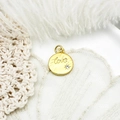 Close-up of golden heart pendant with Love engraving and zircon on lace and feather - Letter Round Disc Style (16.6*13.5mm)