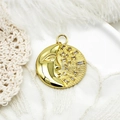 Macro detail of gold moon pendant with micro-paved zircons on white lace background - Moon Round Disk