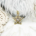 Macro shot of 18K gold plated star charm with micro-pave zircons for DIY jewelry - Micro-pave Zirconia Star