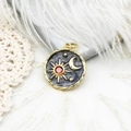 Detail of 18K gold plated sun and moon pendant with a red gemstone and enamel - Grey Star Moon Medallion with Red Zircon (4790032025942)