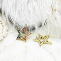 Macro detail of star charms with rainbow cubic zirconia and 18K gold plated connectors - Colorful Zirconia Double Link Star