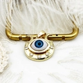 Detailed macro view of 18K gold plated evil eye pendant with blue enamel and zircons - Moon Eye