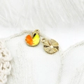 Detailed close-up of geometric 18K gold-plated fruit charms with enamel and embossed finish - Lotus Leaf