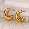 Macro view of polished gold-plated thick C-shaped hoop earrings on a white stand - Gold High Polish C-Shaped Earrings (G8315448)