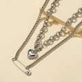 Silver multilayer heart pendant necklace with pin elements on minimalist pedestal - White Gold