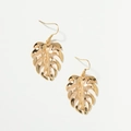 Detail of gold monstera leaf earrings with intricate hollow cuts in a bohemian style - Gold (E0454 Gold)