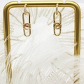 Detail view of 18K gold plated bow earrings with zircon stones on a white feather background - Safety Pin Stud Earrings (Pair)