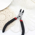 Detail showing diagonal cutting pliers for DIY jewelry making with red and black handles - Diagonal Pliers