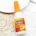 Close-up of Kroxx KX-10 20g high-strength instant glue bottle on white lace background - Fast Dry Glue Model 2
