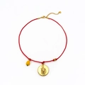 Red braided rope necklace featuring a golden zodiac relief pendant and yellow drop charm - Leo