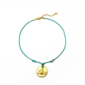 Handmade woven cord necklace with gold zodiac pendant and green heart zircon - Scorpio