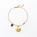 Handmade red and white woven zodiac necklace with gold relief pendant and green heart gem - Sagittarius